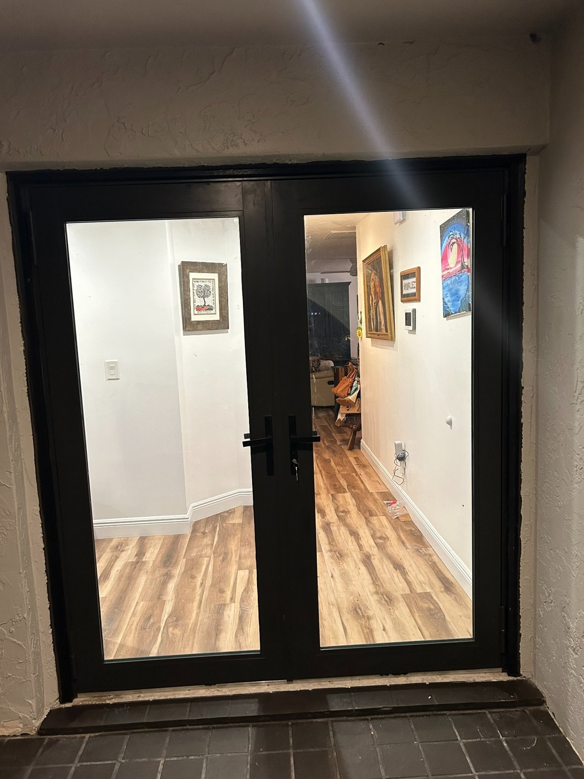 Modern impact-rated glass entry door installed by LSF Partners