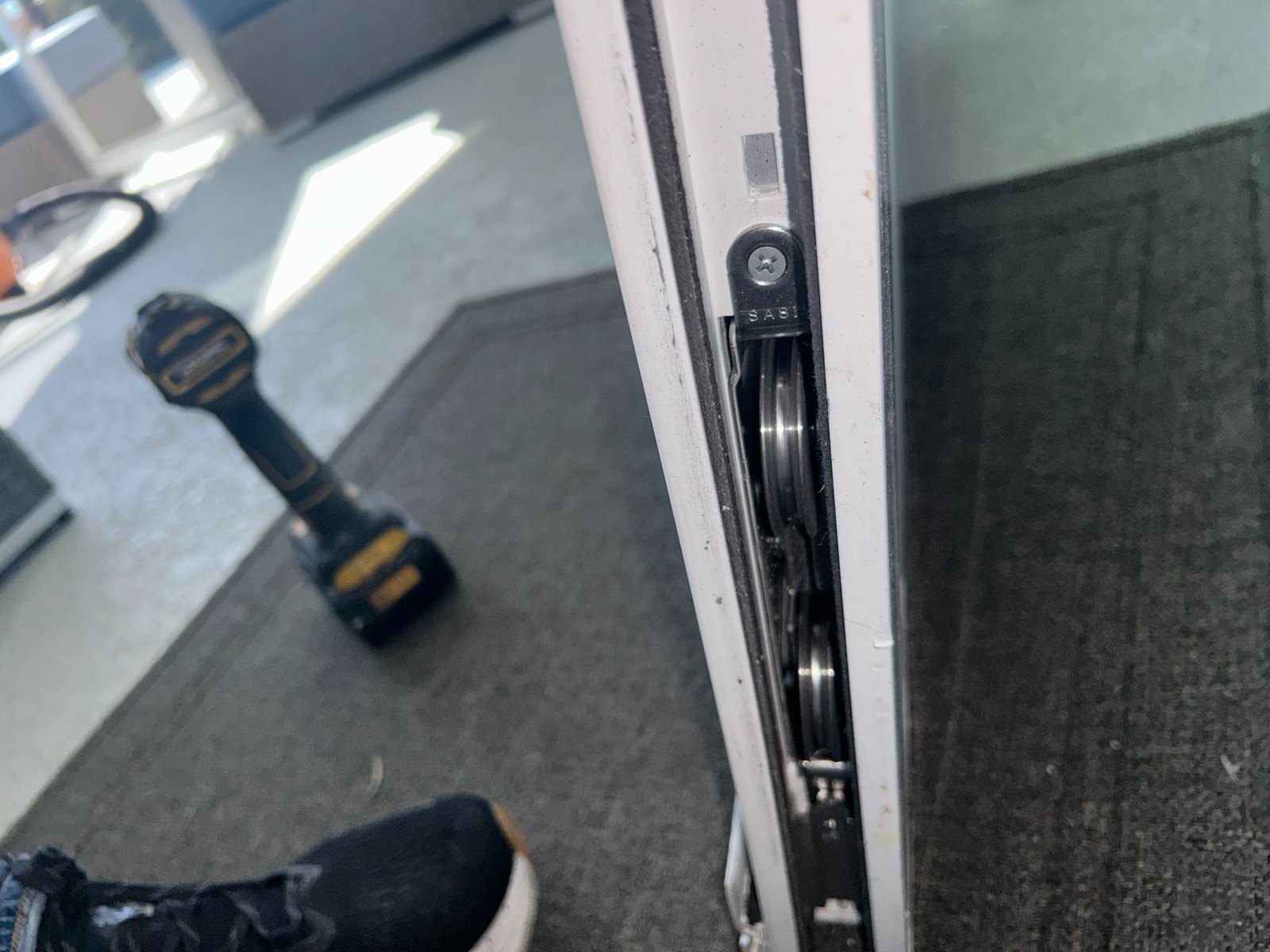 New roller installed in sliding glass door panel