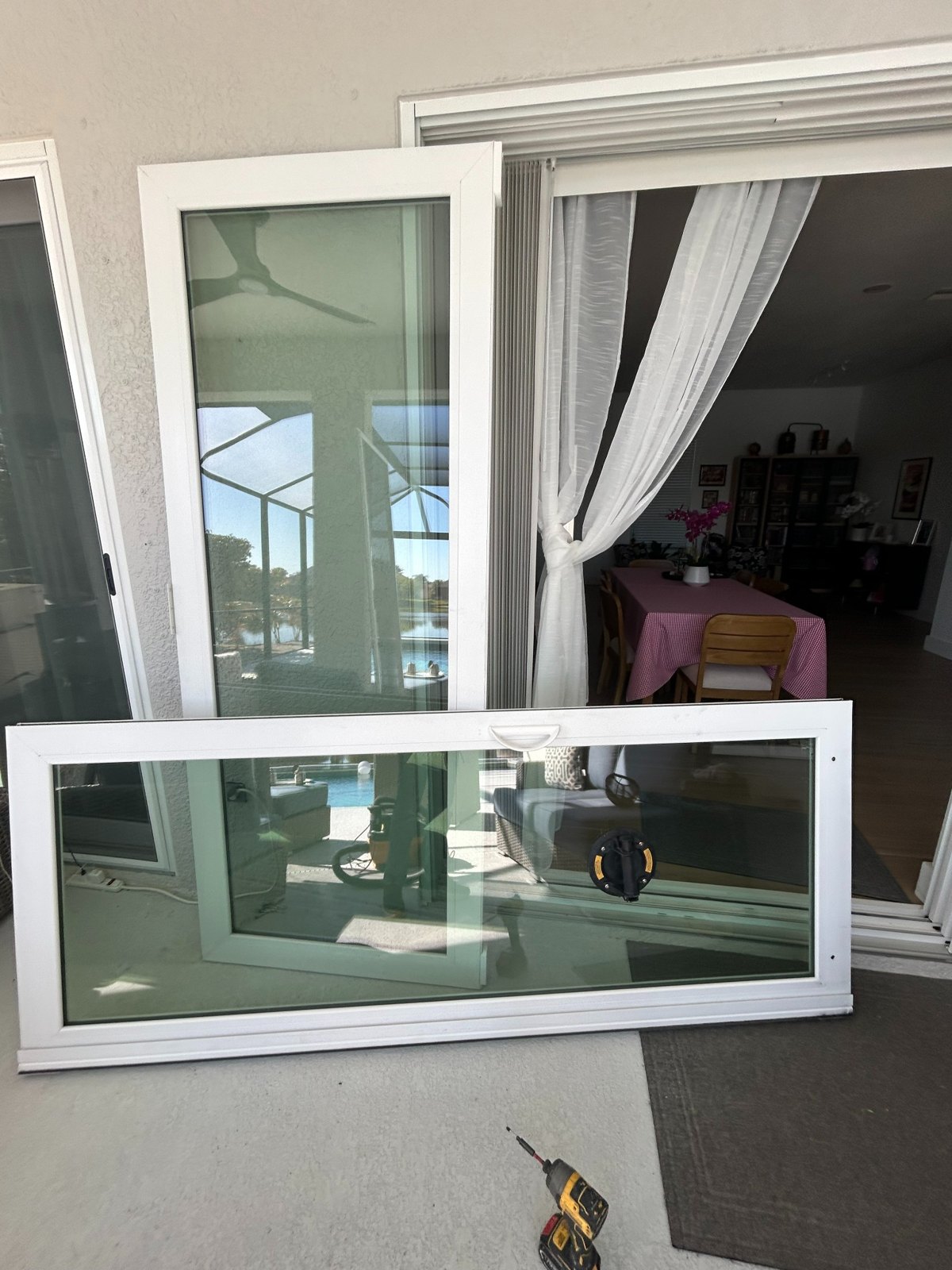 Sliding glass door panel removed for roller service